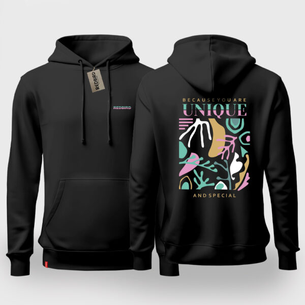 Drei stilvolle Redbird-Hoodie für Frauen in den Farben Schwarz mit einem einzigartigen grafischen Design auf der Rückseite. Das Motiv kombiniert farbenfrohe, abstrakte Formen und den inspirierenden Text „Weil du einzigartig und besonders bist“.